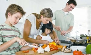 Family cooking together in kitchen